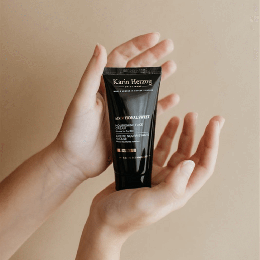 A womans hand holding a Additional Sweet product