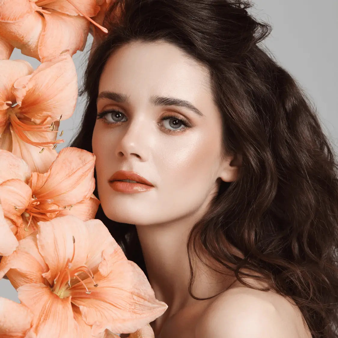 Model with radiant complexion and soft peach-toned make up, showcasing Karin Herzog Make Up Collection’s natural, oxygen-infused glow.